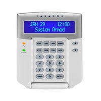 Paradox 32-character blue LCD keypad module with white housing, numeric keypad, and status indicators for security systems