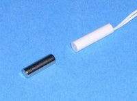 1/4 inch recessed magnetic alarm contact in white and black components on blue background