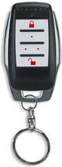 Paradox 4-button remote control with backlit buttons, black plastic housing with chrome trim and detachable keyring